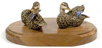 Mallard Ducks with Opened Wings on a Base