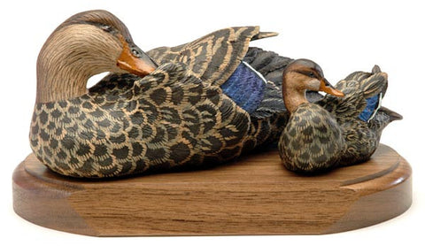 Female Mallard and its Ducklings on a Base