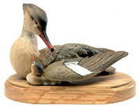 Red-breasted Merganser and Ducklings on a base